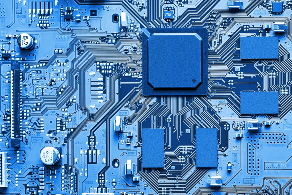 Blue electronic circuit board with microchip — silver's role in technology from circuits to screens